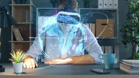 Professional worker works with virtual reality glasses with 3d planet Earth holo Stock Footage