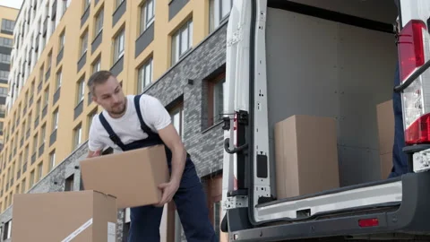 Professional Workers on Piling Boxes for Transportation. Concept of Trade Transi Stock Footage 199479657