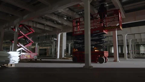 Professional workers stand on freight-passenger elevator ground Stock Footage 258763418