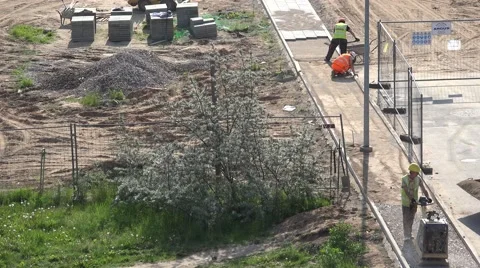 Professional workers team work on pavement construction. 4K Stock Footage 62498916