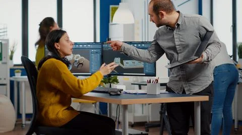 Professional workers using high-tech industrial program Stock Photos
