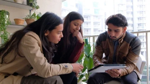 Professional workers working on touch screen tablet and have a thinking discussi Stock Footage 101362984