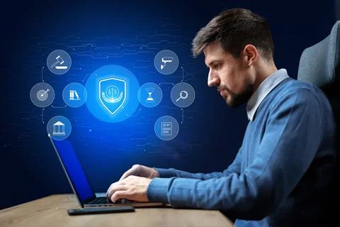 Professional working on cybersecurity solutions in a modern office setting 스톡 사진