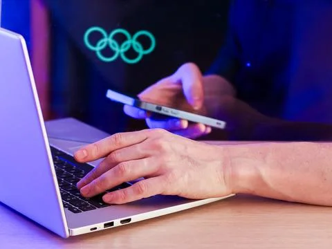 Professional working on devices with circular data graphics background Stock Photos