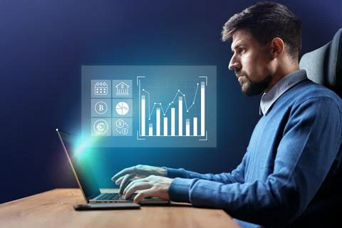 Professional working on financial analysis with data visualization on laptop in Stock Photos