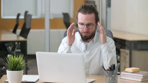 Professional working on his laptop in a modern office. Video stock 279868566