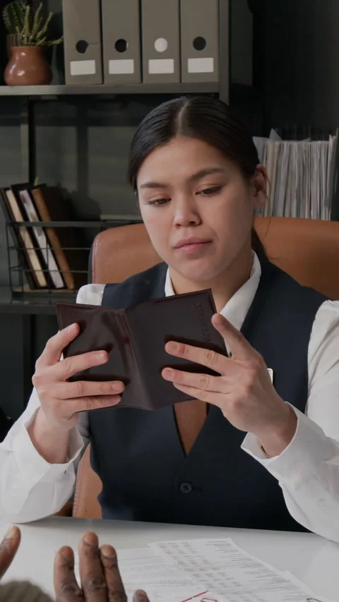 Professional Young Bank Worker Checking Passport and Documents of Client Stock Footage 330961697