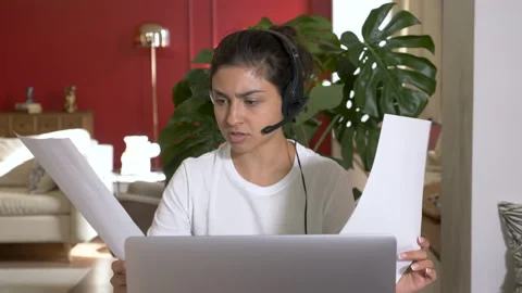 Professional young designer checking plan with electronical version on computer Stock Footage 141034529