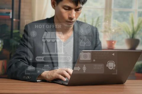 Professional Young Man Using Laptop with Virtual Interface in Modern Office Stock Photos