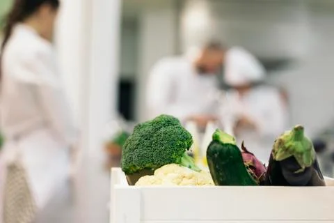 Professionals chefs cooking together. Stock Photos