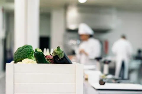 Professionals chefs cooking together. Stock Photos