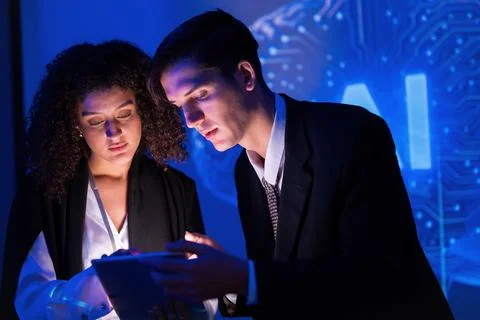 Professionals discussing artificial intelligence trends during a nighttime .. Stock Photos