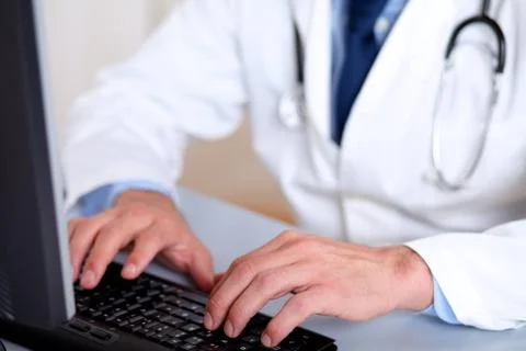 Professionals doctor hands working on computer Stock Photos