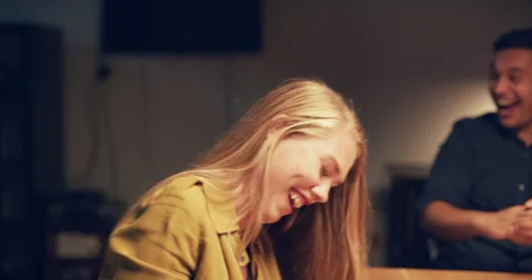 Professionals working late into the night eat pizza and laugh in modern warmly l Video stock 199457097