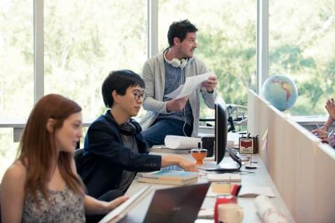 Professionals working in shared office Stock Photos