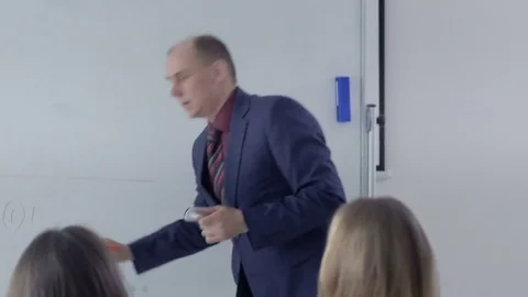 Professor asking for students' opinion in a classroom Stock-Footage 69931538