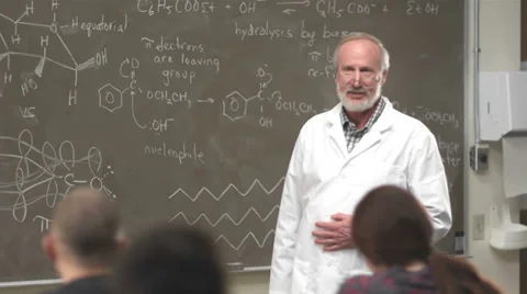 A professor gives a lecture to his class Video stock 33877623