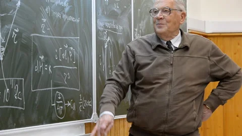 Professor gives a lecture on physics Stock-Footage 103997399