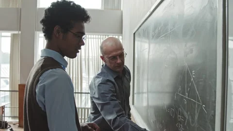 Professor Helping Student to Solve Geometry Problem Stock-Footage 155463597