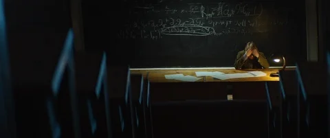 Professor or scientist is thinking about solving a complex equation or formula Stock Footage 123277603