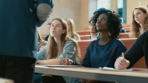 Professor Reads Lecture to a Multi Ethnic Group of Students. Smart Young People. Stock Footage