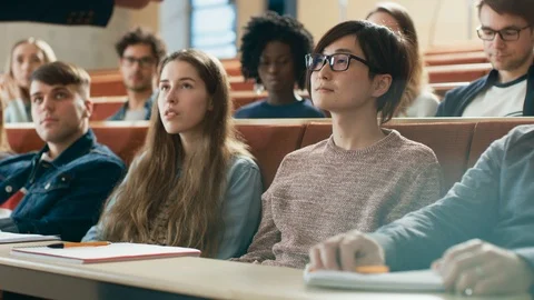 Professor Reads Lecture to a Multi Ethnic Group of Students. Stock Footage 87971457