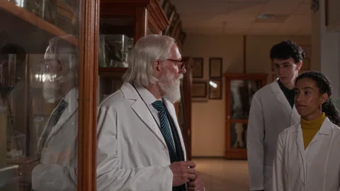 Professor Showing Museum Artifacts to Med Students while Guiding Excursion Stock Footage 314463270