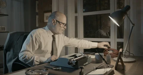 Professor sitting at desk and having a phone call Stock Footage 151176017