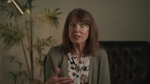 Professor Talking with Her Hands as She Teaches on a Video Call Stock Footage 208791148