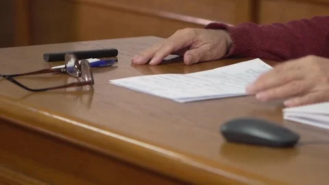 The professor teaches at the university. Professor's hands on the desk Stock Footage 303346803