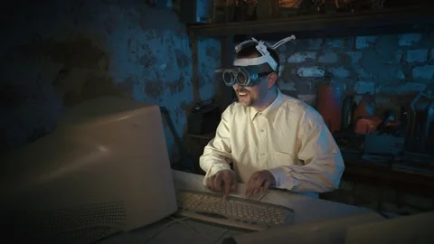 The professor is typing on the keyboard. Clandestine laboratory Nutty Professor. Stock Footage 154093574