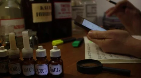 Professor using mobile digital devices Stockbeeldmateriaal 58797941