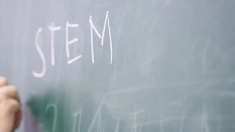 Professor writes on the blackboard. Stock Footage 133156349