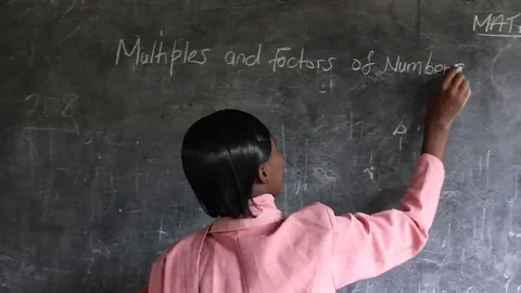 Professor writes on the blackboard at school Stock Footage 69241711