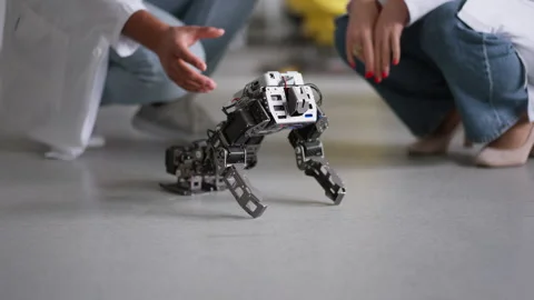 Professors, teachers in engineering looking at students project, testing and Stock Footage 277210687