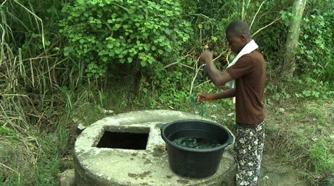 PROFILE: ADEISO BOY GETS WATER FROM WELL Stock Footage 58070150