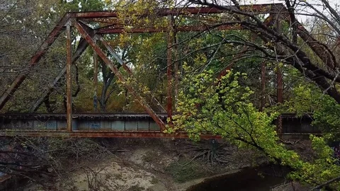 Profile Aerial of Old Train Bridge Stock Footage 82124544