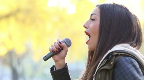 Profile of beautiful woman singing Stock Footage 59556660