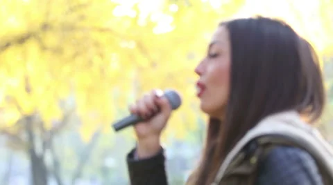 Profile of beautiful woman singing Stock Footage 59556665