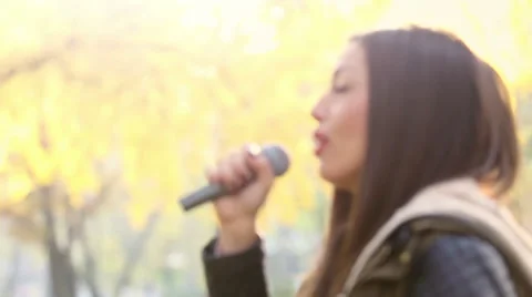 Profile of beautiful woman singing Stock Footage 59556666