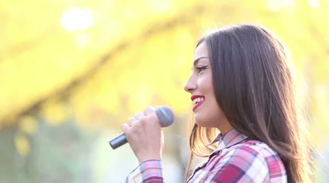 Profile of beautiful woman singing Stock Footage 59556680
