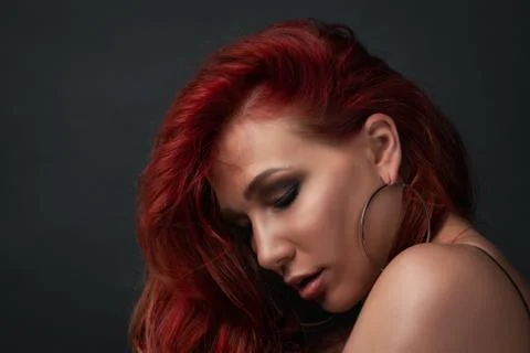 Profile of beauty model posing close-up against black background. beautiful w Stock-Fotos