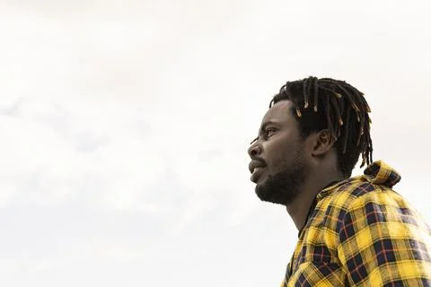 Profile of a black with the sky in the background Stock Photos