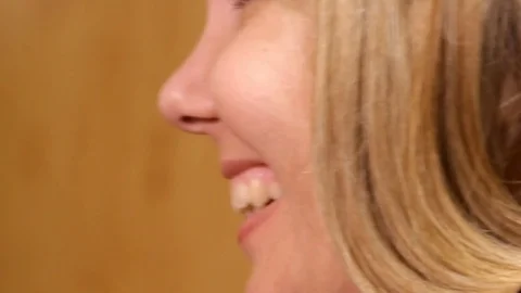 Profile blonde who smiles while talking, close-up Stock Footage 82800597