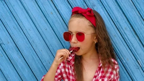 Profile of a child who eats candy Stock Footage 169322726