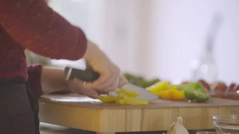 Profile Close up View of Chef in Apron Chopping Vegetables at Kitchen Counter Stock Footage 208710723