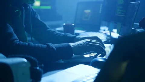 Profile of confident programmer coding technology typing on laptop in the smoky Stock Footage 108819168
