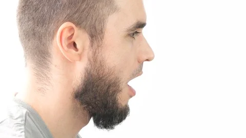 Profile of crazy bearded man sticking his tongue Video stock 75407515