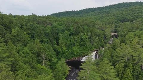 Profile Falls waterfall with stone arch bridge in background, New Hampshire Stock Footage 342888798