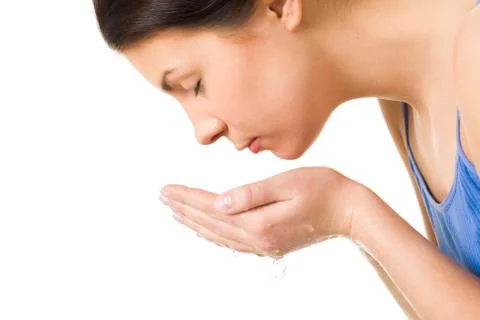 Profile of fresh female washing her face Stock Photos